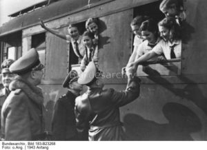 Children on a train saying good-bye to their parents